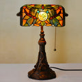 10-inch Tiffany stained glass table lamp with resin base on a wooden desk.