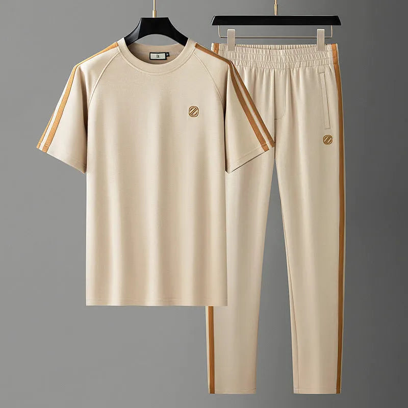 Men's blue short sleeve polyester suit with separate top and trousers for sports wear