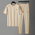 Men's blue short sleeve polyester suit with separate top and trousers for sports wear