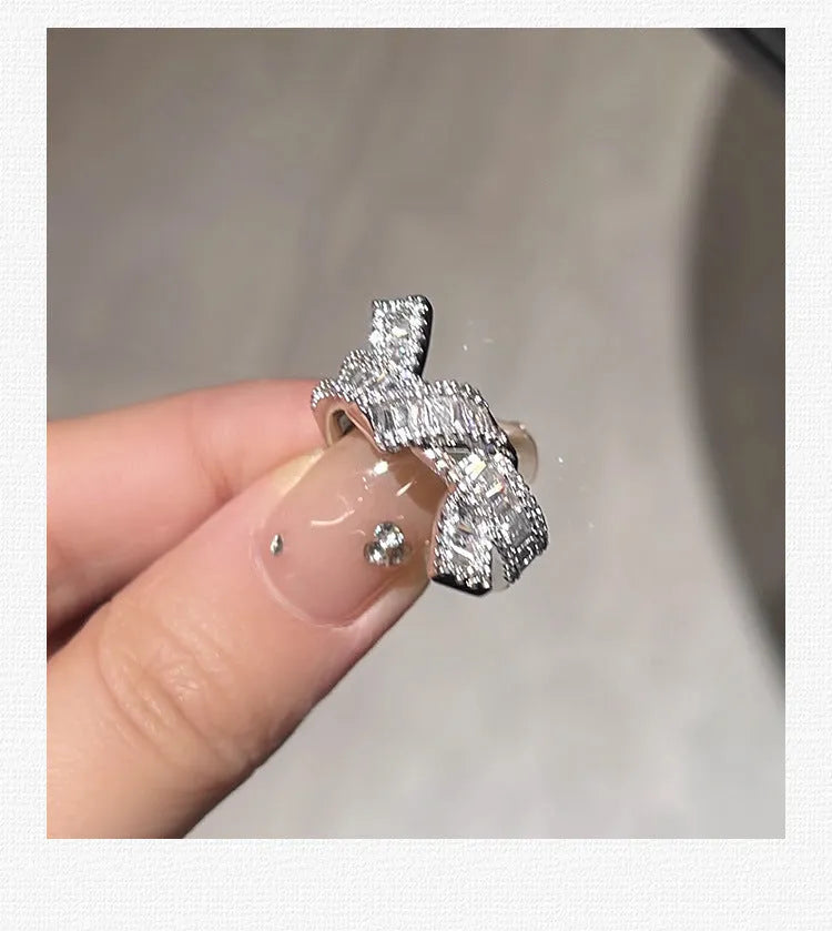 Silver cross open ring with bow shape, copper base with electroplated finish, minimalist light luxury style