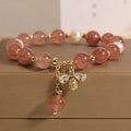 Women's bracelet with freshwater pearls, strawberry quartz stones, zircon accents and alloy bee charm