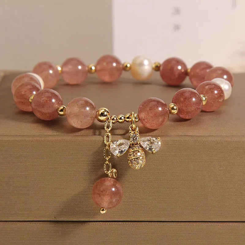 Women's bracelet with freshwater pearls, strawberry quartz stones, zircon accents and alloy bee charm