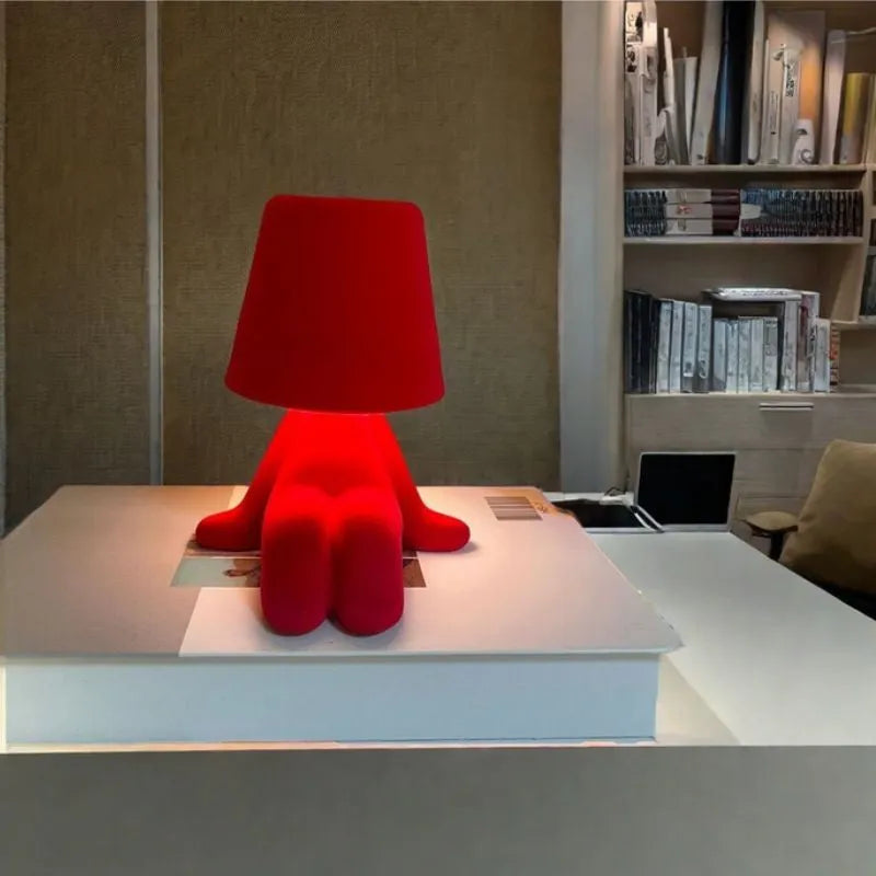 Thinker small gold statue LED night lamp with USB cable on restaurant bar table