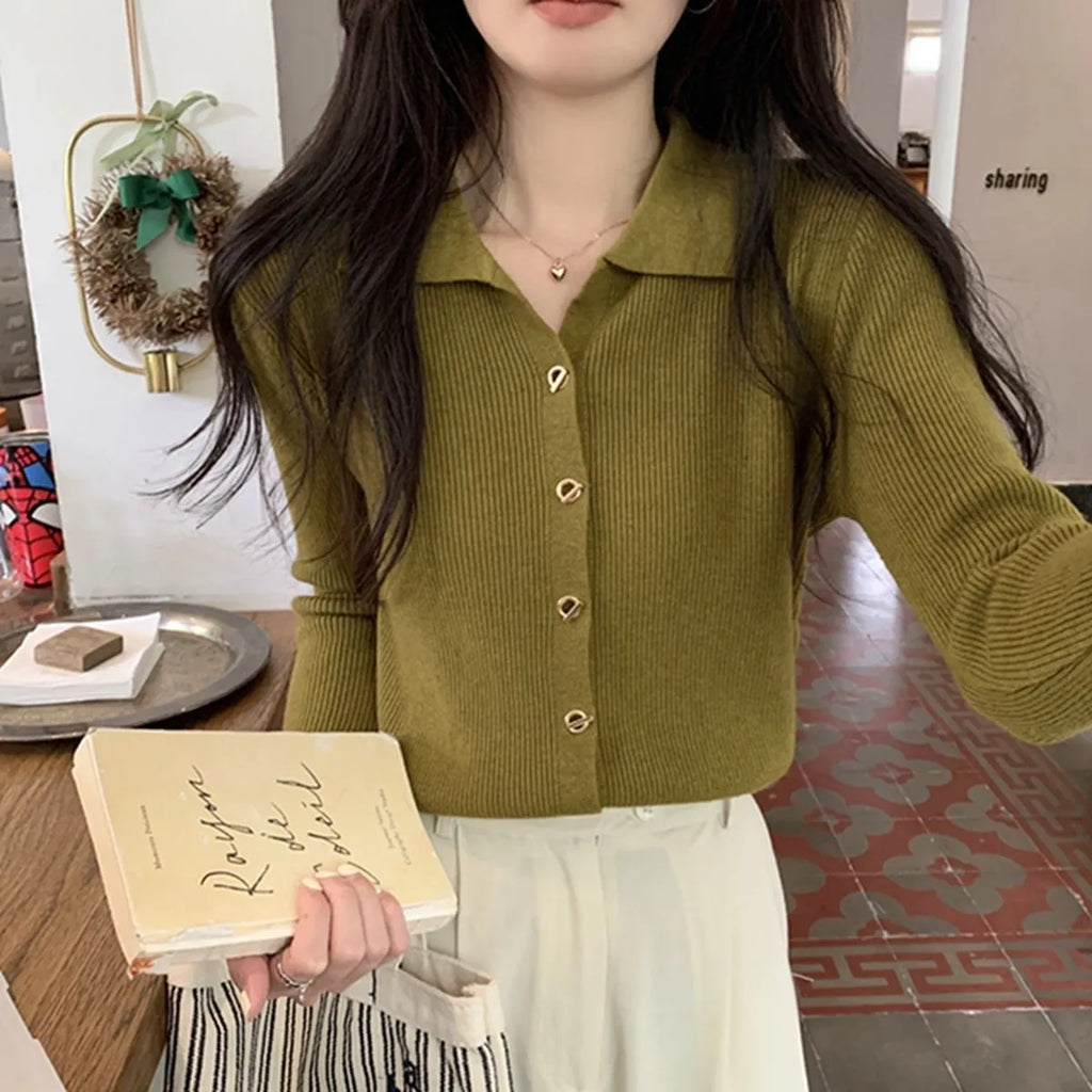 Loose fit knitted cardigan in beige, shown worn open as a long-sleeved top