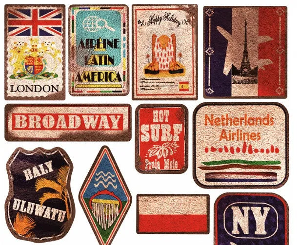 Assortment of large retro beach stickers with surfing and travel designs on a white background.