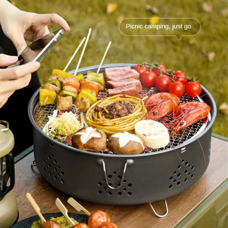 Portable stainless steel charcoal barbecue grill with detachable legs and storage bag