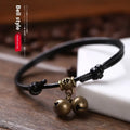 Adjustable nylon dog halter collar with brass bell shown in black rope colour fitting small dog
