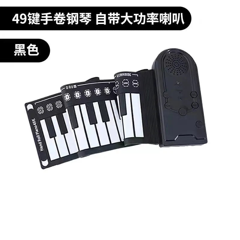 Portable folding 49-key electronic keyboard with speaker in compact rolled position showing silicone rubber keys and ABS plastic controls