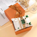 Gold Green square alloy watch and four matching butterfly bracelets laid out as a five-piece set.
