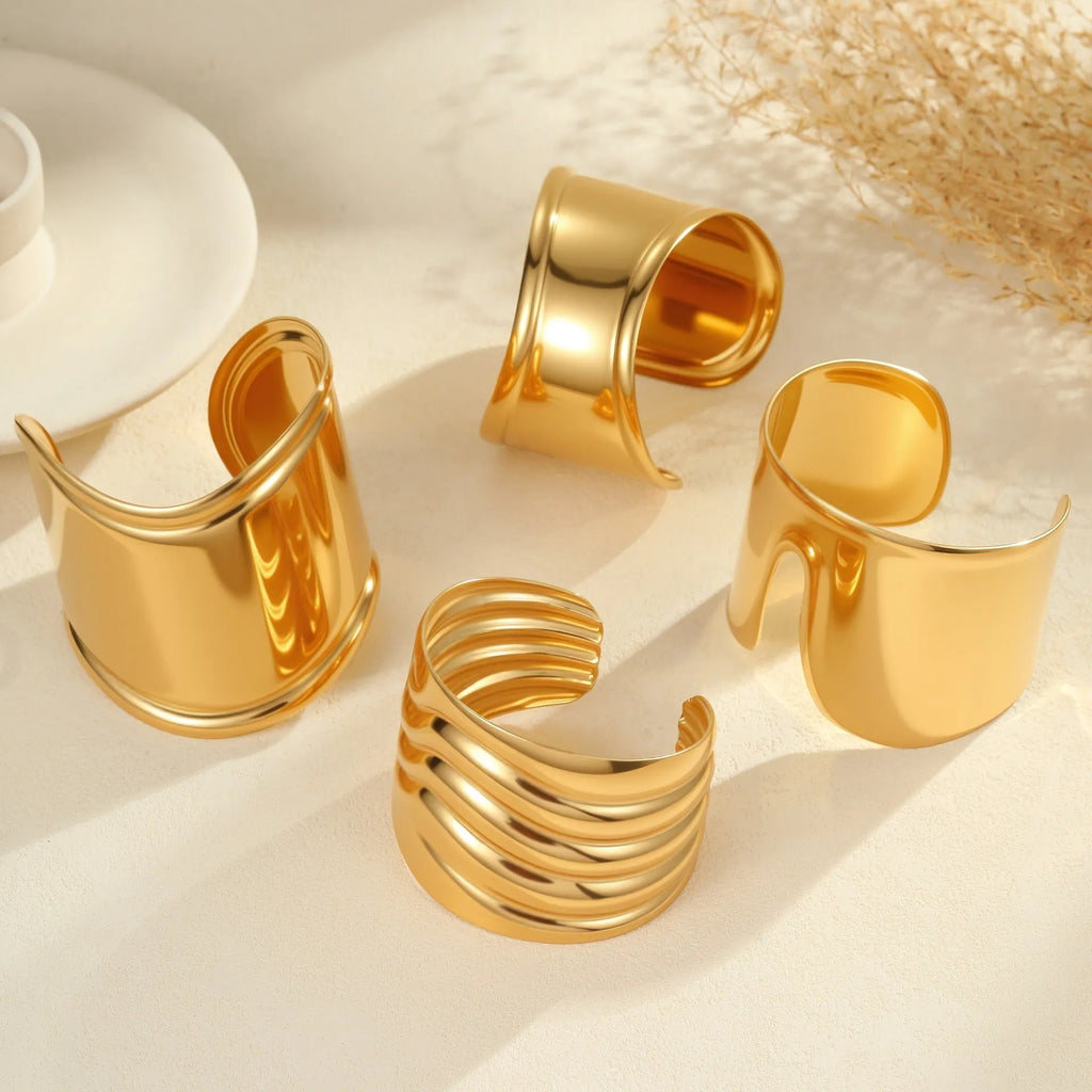 Women's gold-plated wide bracelet with stainless steel construction and geometric design