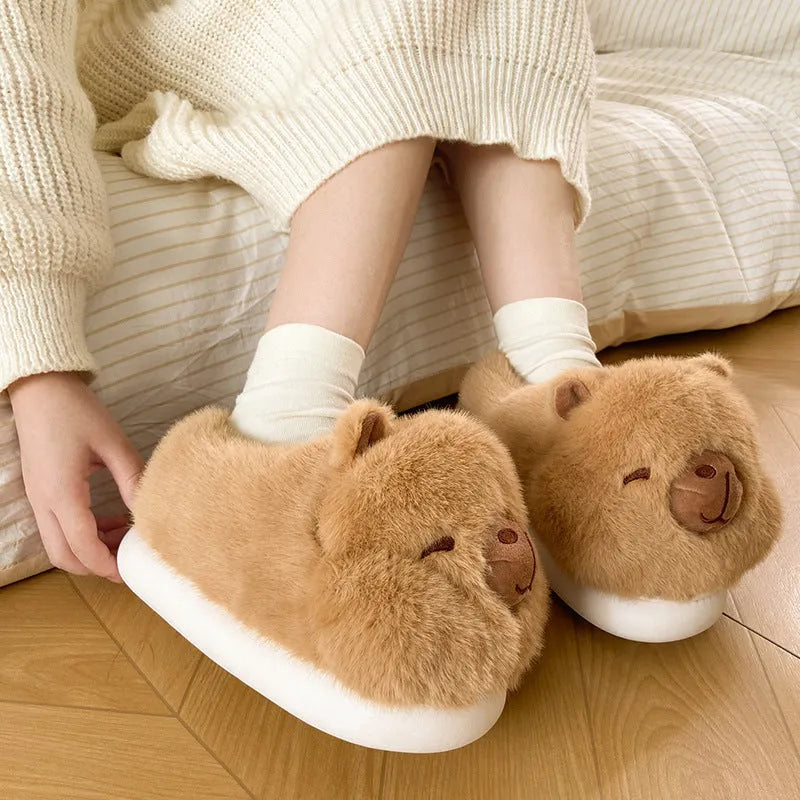 Light brown women's winter slippers with plush upper, artificial wool lining, and PVC sewn soles