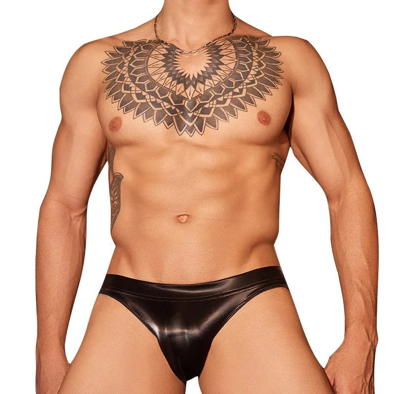 Men's black and white shark skin lace briefs showing textured polyester fabric construction