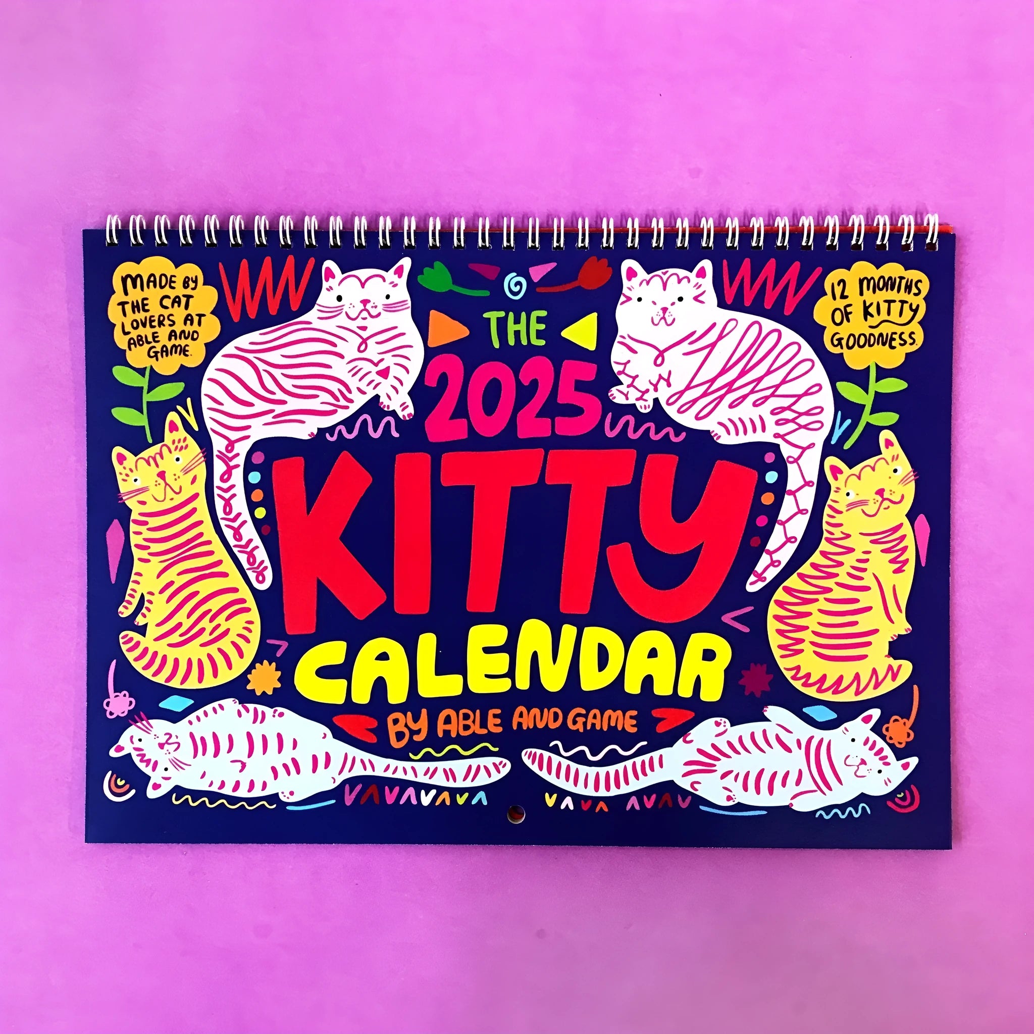 Cat calendar wall planner showing monthly grids with feline illustrations on A4 paper