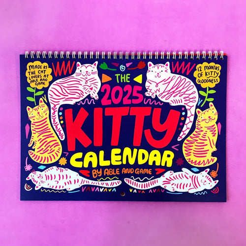 Cat calendar wall planner showing monthly grids with feline illustrations on A4 paper