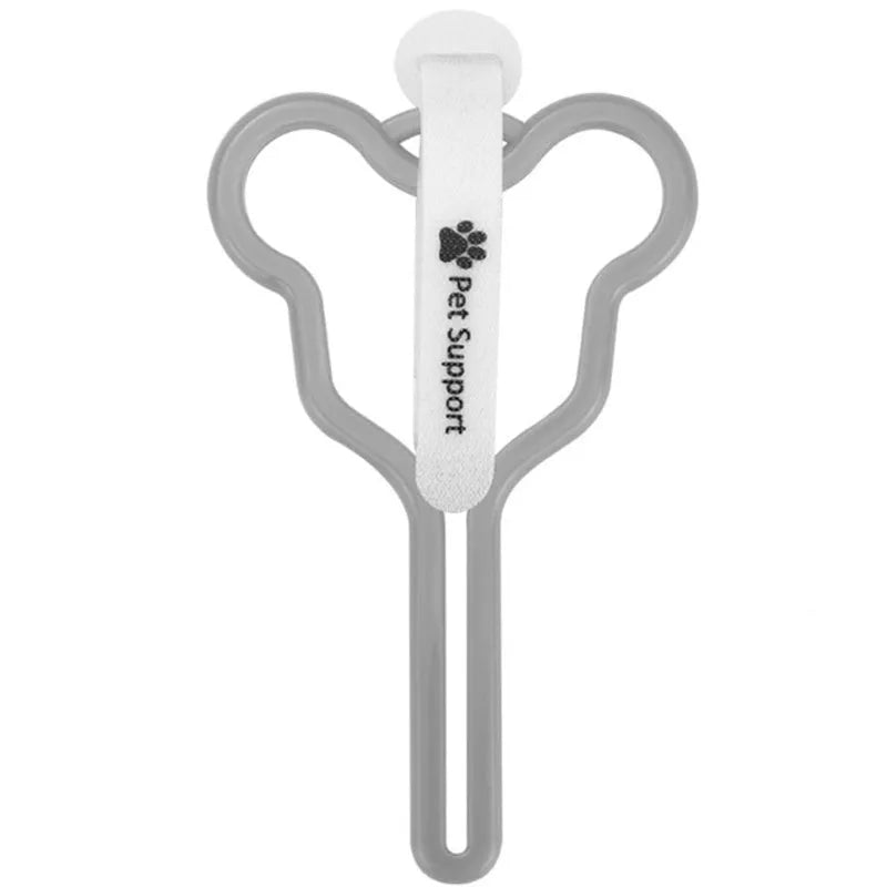 A coloured hands-free dog poop bag holder with a fixed clip and velcro strap attached to a dog leash.