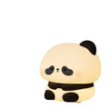 Panda LED night light with soft silicone head and colourful glow on a wooden table