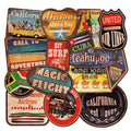 Assortment of large retro beach stickers with surfing and travel designs on a white background.