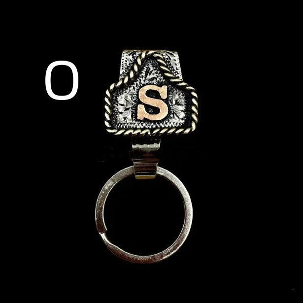 Handmade metal cow tag belt keychain in a selected colour from the A-Z letter range.