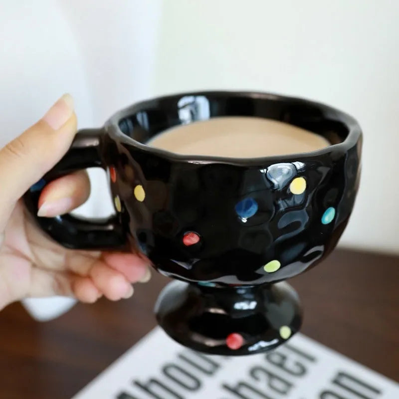 Hand-pinched irregular ceramic mug in solid colour with modern design