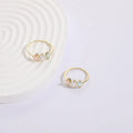 Geometric triangle design women's ring with horse eye motifs and tricolor zircon stones in 14k gold colour