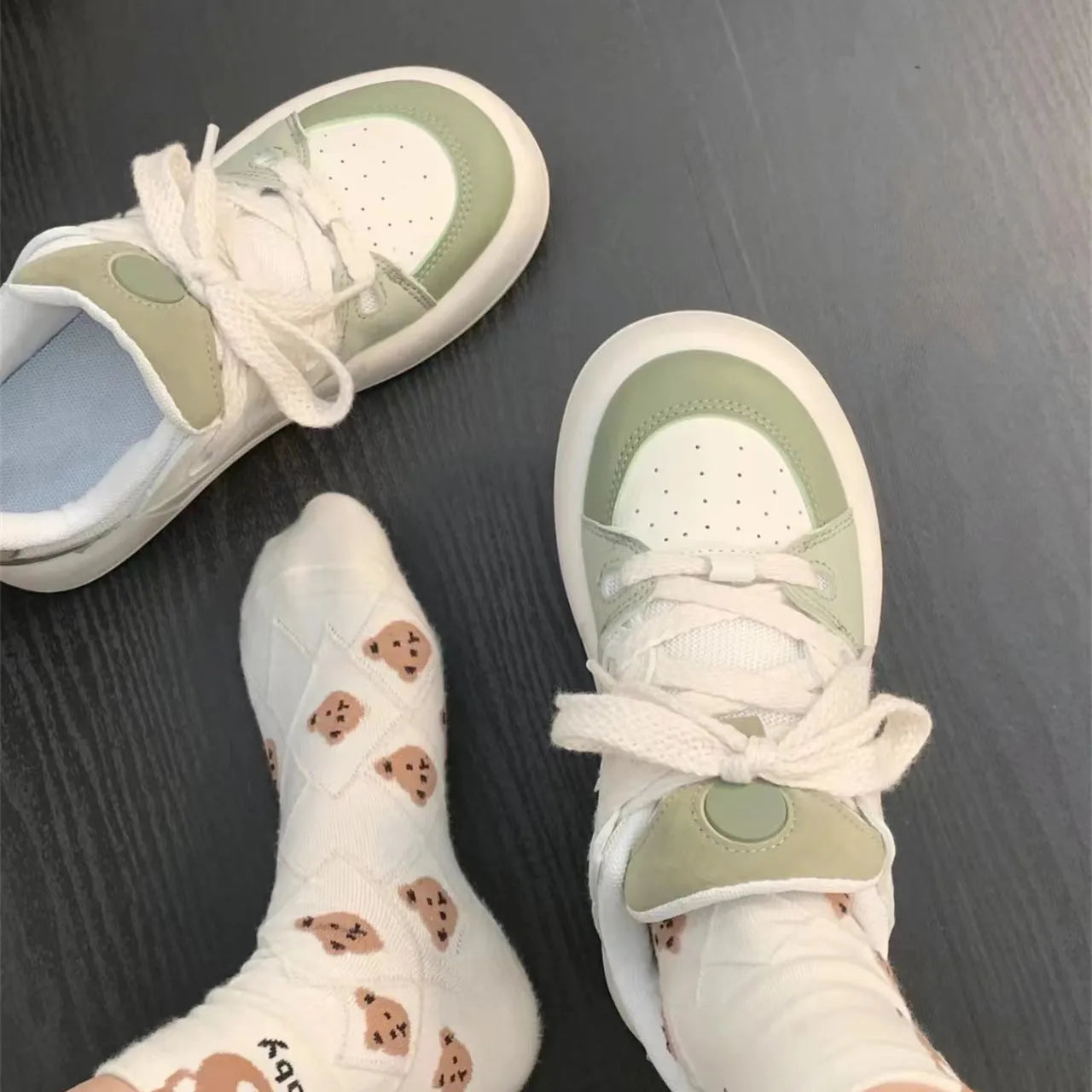 Green women's casual shoes with mesh upper, round toe, and flat non-slip sole.