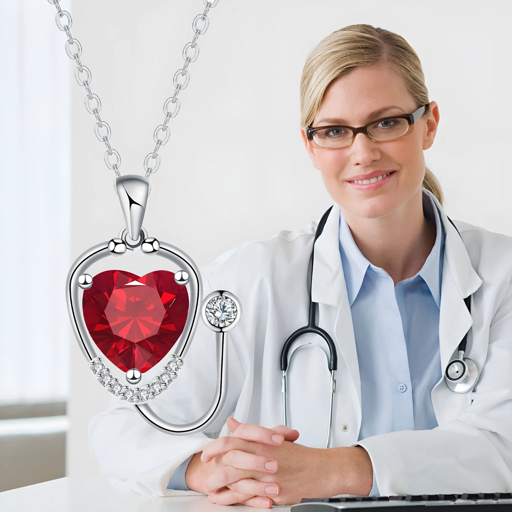 Women's copper stethoscope necklace with red diamond colour pendant on model