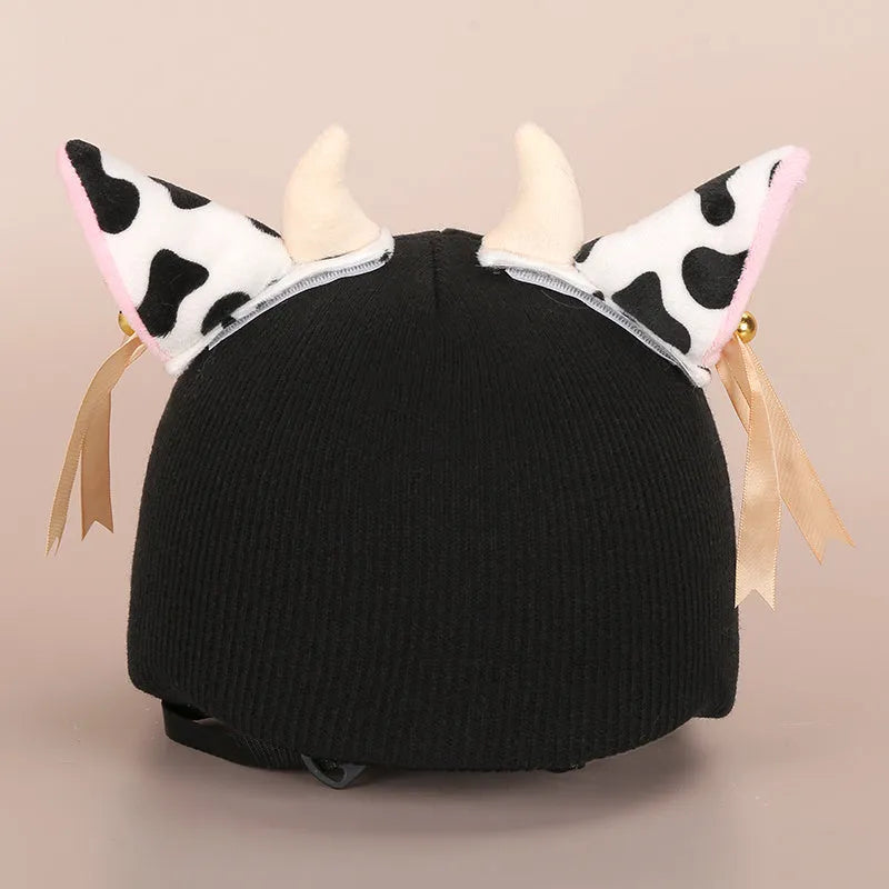 Plush fabric motorcycle helmet liner and cartoon-themed ear covers set in size M.