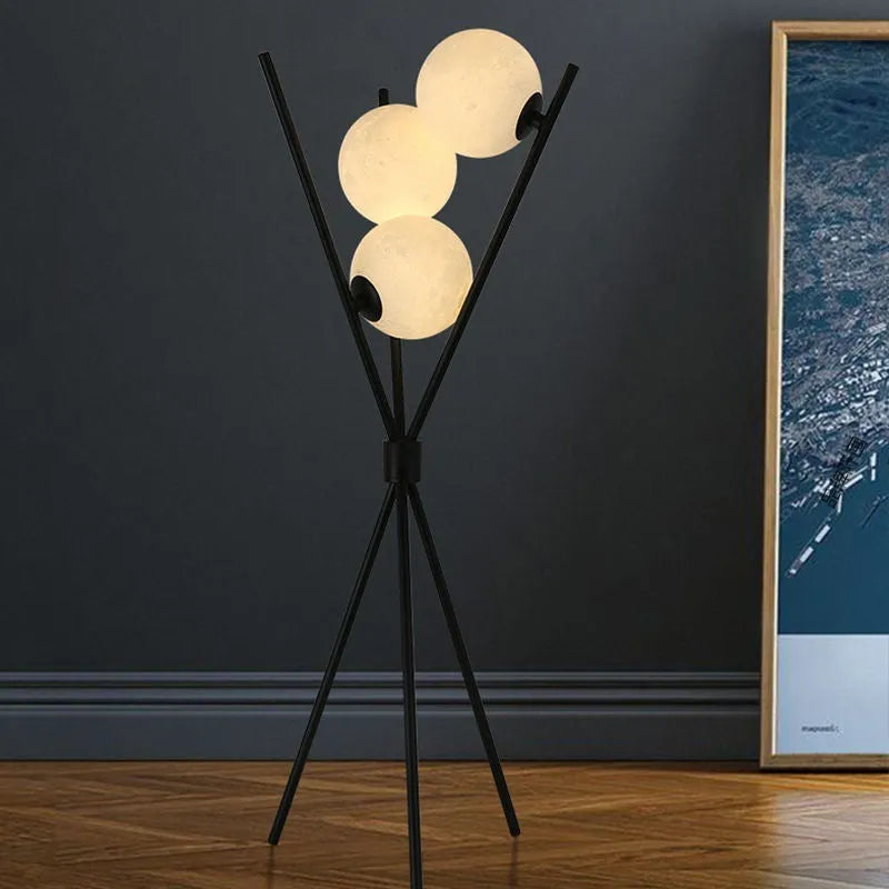 Scandinavian LED table lamp with iron body and acrylic shade on a white table, offering three light colour options
