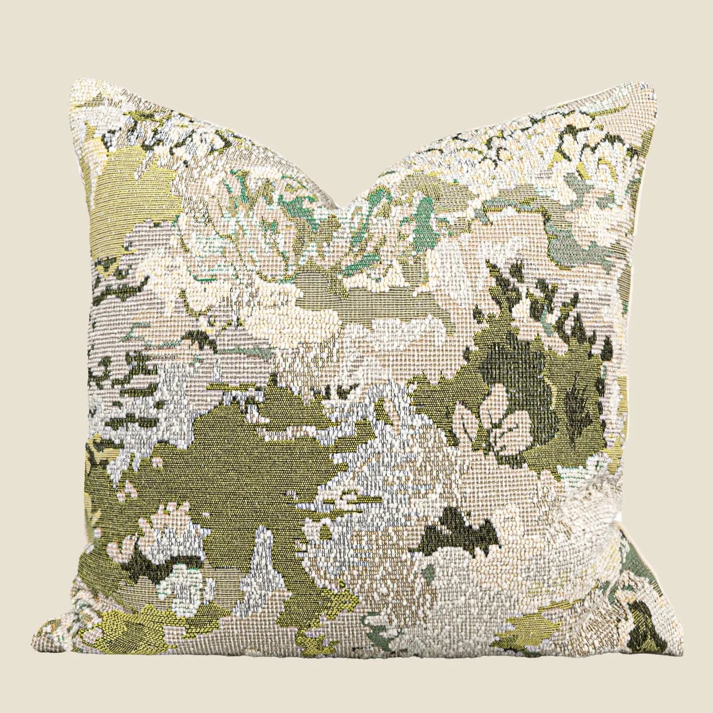 Green abstract floral pattern on a wool blend cushion cover, shown in square and lumbar pillow sizes.