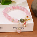 Women's aquamarine crystal bracelet with pink and blue dopamine colours, round geometric beads, handcrafted mixed materials