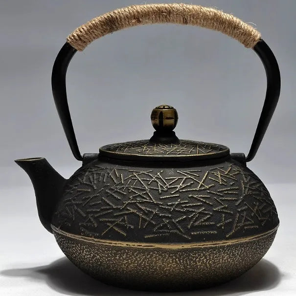 Japanese style cast iron teapot with traditional design and 0.9L capacity for tea brewing
