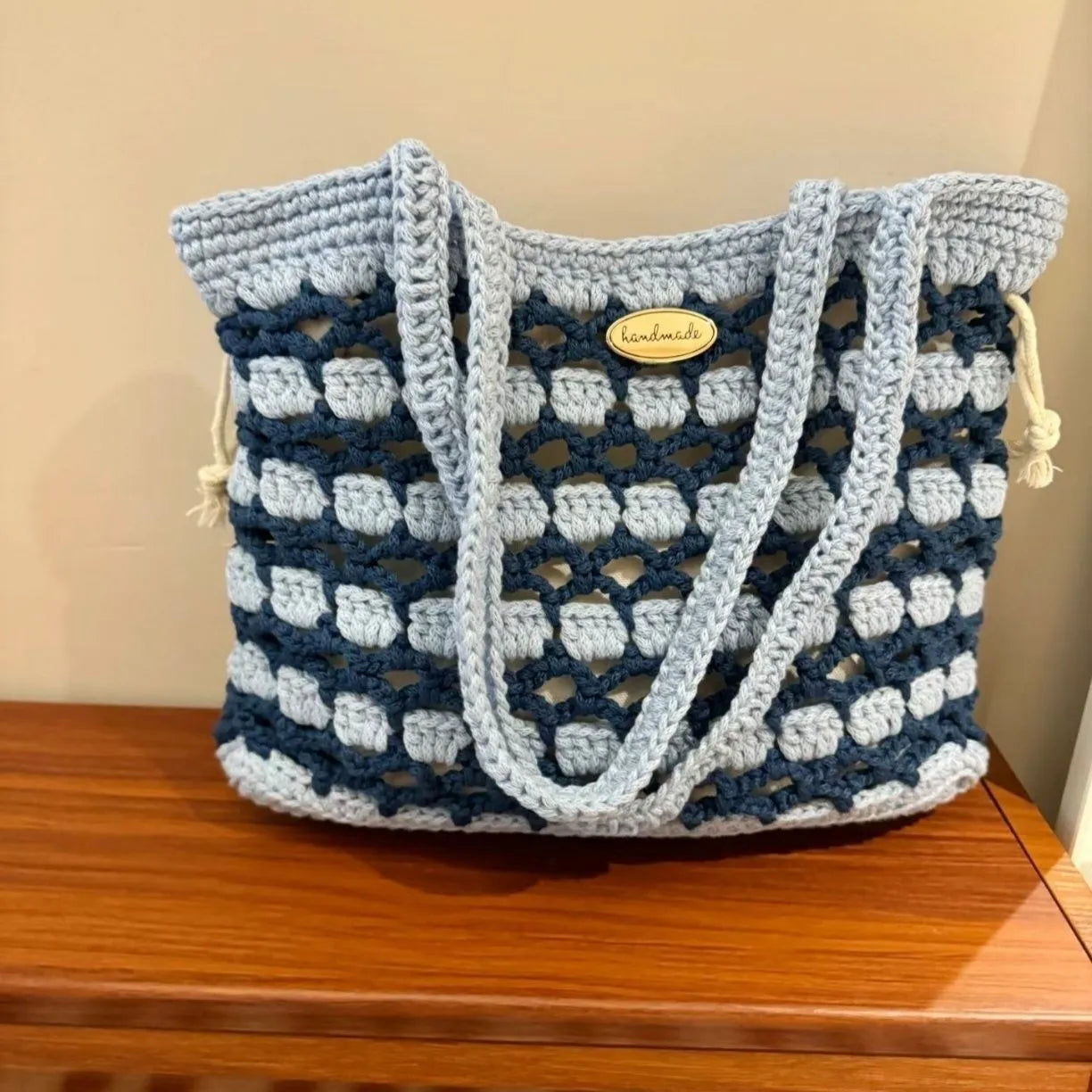 Handwoven wool floral handbag in summer style with natural pattern