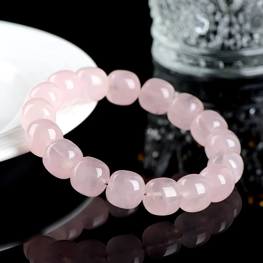 Pink crystal barrel bead bracelet with natural bamboo elements and geometric design