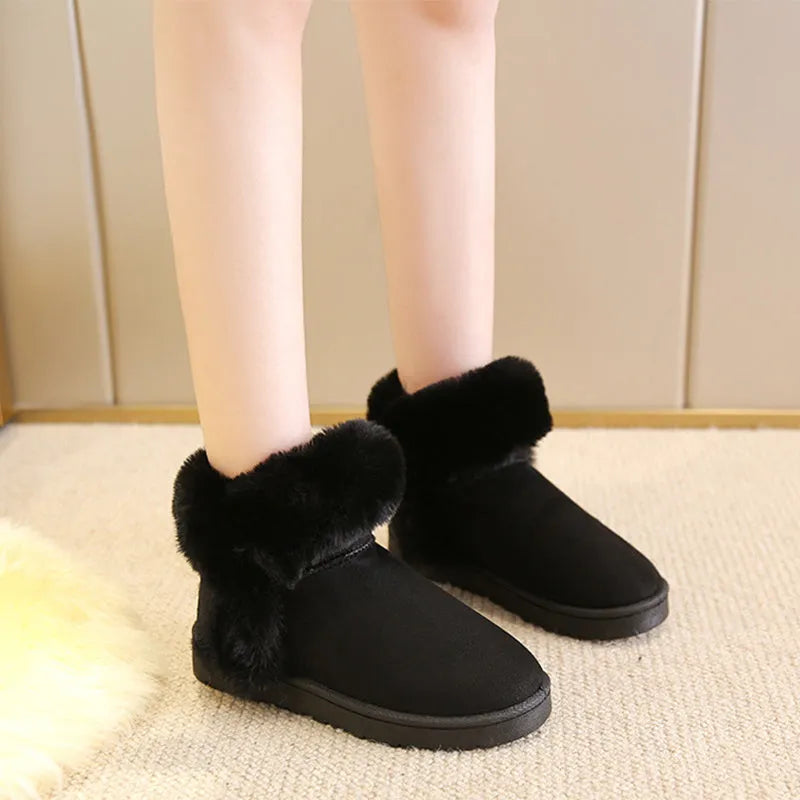 Women's winter snow boots in beige with fluffy platform, round toe, and artificial wool lining on a white background