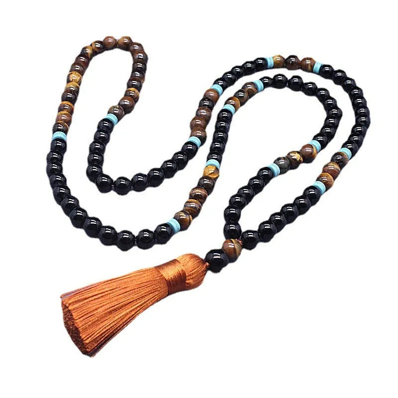 Natural agate jewellery set showing black agate bracelet and Tiger stone necklace with geometric design