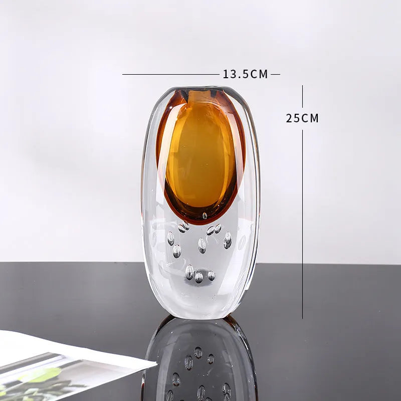 Small glass vase with amber coloured glaze, abstract modern shape, 13.5x25cm size on table