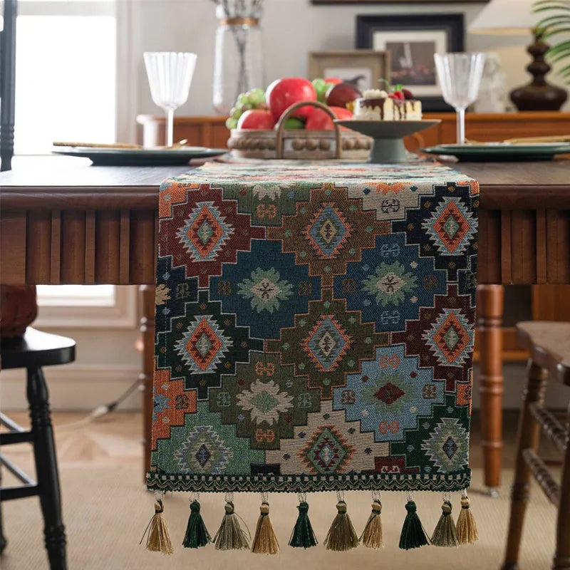 Nordic jacquard bouquet pattern table runner with decorative tassel trim in dark blue colour