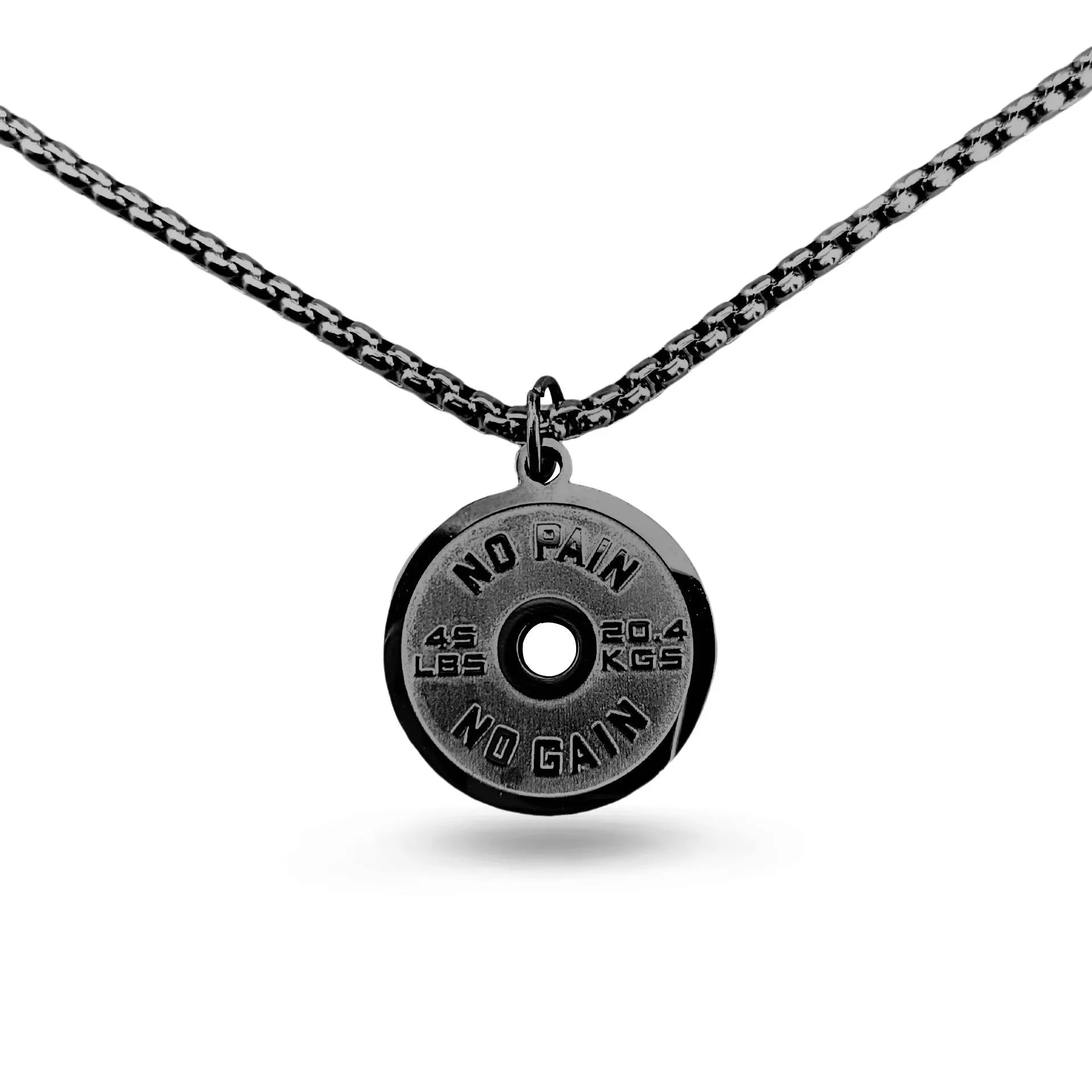 Polished stainless steel geometric barbell disk pendant on a choice of 60cm chains: black, gold, or pearl.