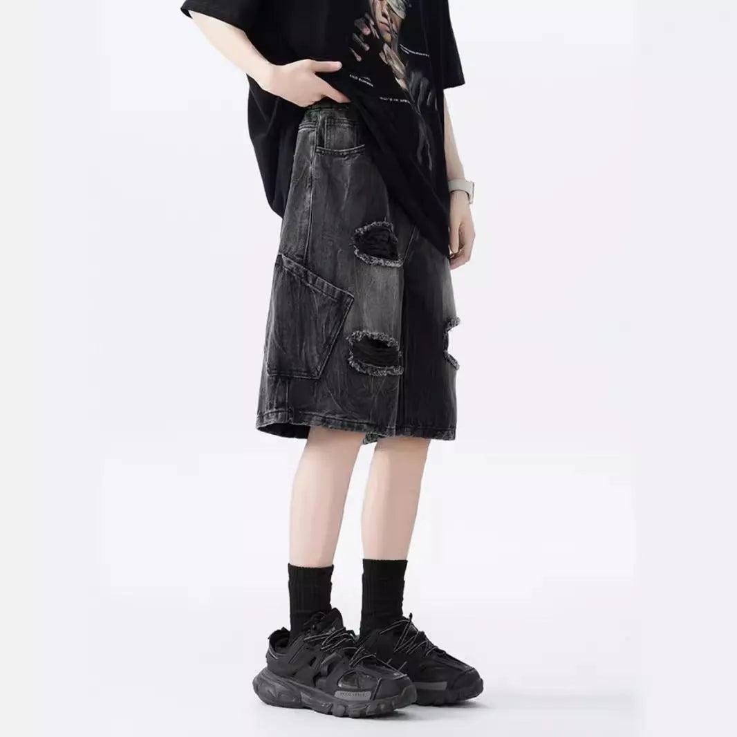 Women's washed denim shorts with ripped detailing in loose retro fit, shown in black and blue colour options