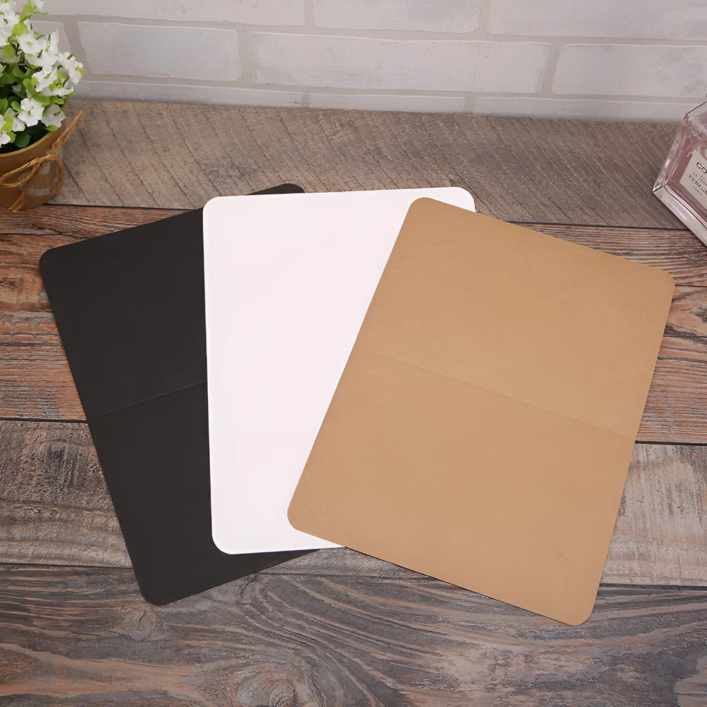 Blank folded kraft card 10x15cm in cowhide colour, packed in a stack of 100 for stationery use