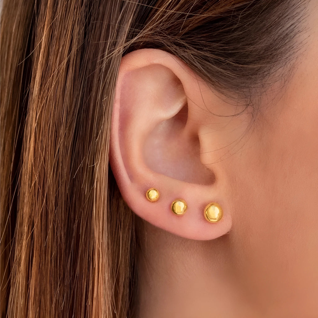 Titanium steel ball stud earrings in gold or silver finish, available in 3mm to 6mm sizes