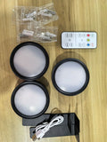 Wireless LED painting lamp with a magnetic mounting belt and remote control in black finish.
