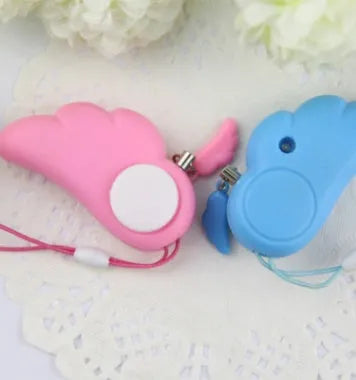 Blue personal security alarm with clip attached to a handbag strap, showing compact size and pull-rope mechanism