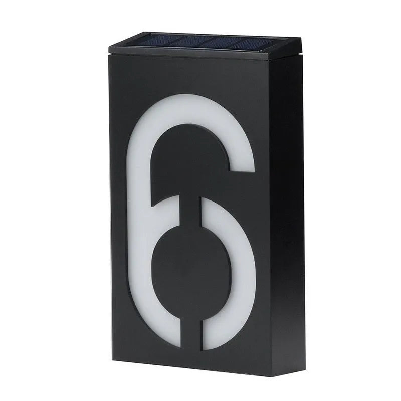 Solar powered outdoor house number light with white LEDs and wall mount.