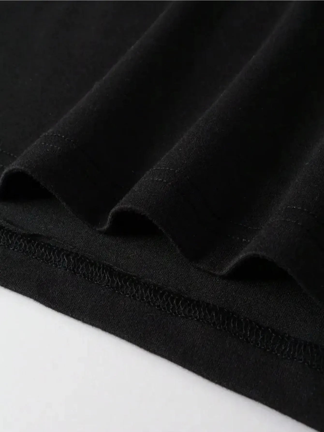 Black cartoon printed short sleeve cotton T-shirt on plain background