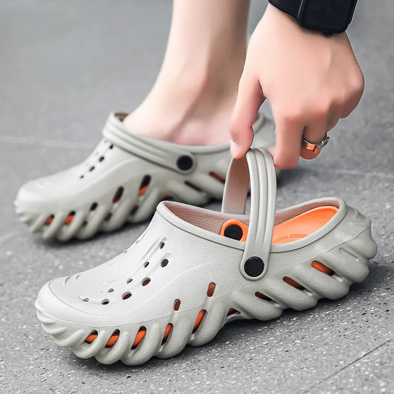 Men's beige EVA slipper sandals with hollow-out design and textured non-slip sole.