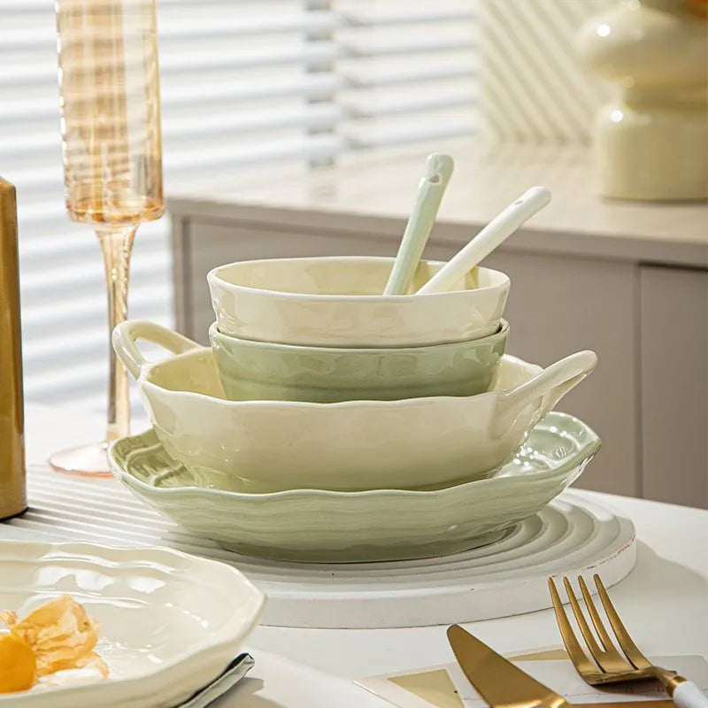 Seven-piece solid colour ceramic tableware set with modern Japanese style design on a table.