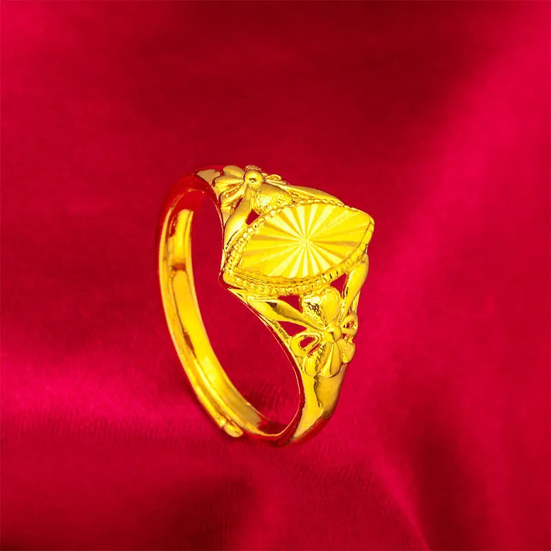 Gold electroplated brass ring with geometric open diamond flower design and textured surface