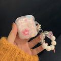 Pink transparent AirPods protective case with three-dimensional five-pointed star pattern and hand rope