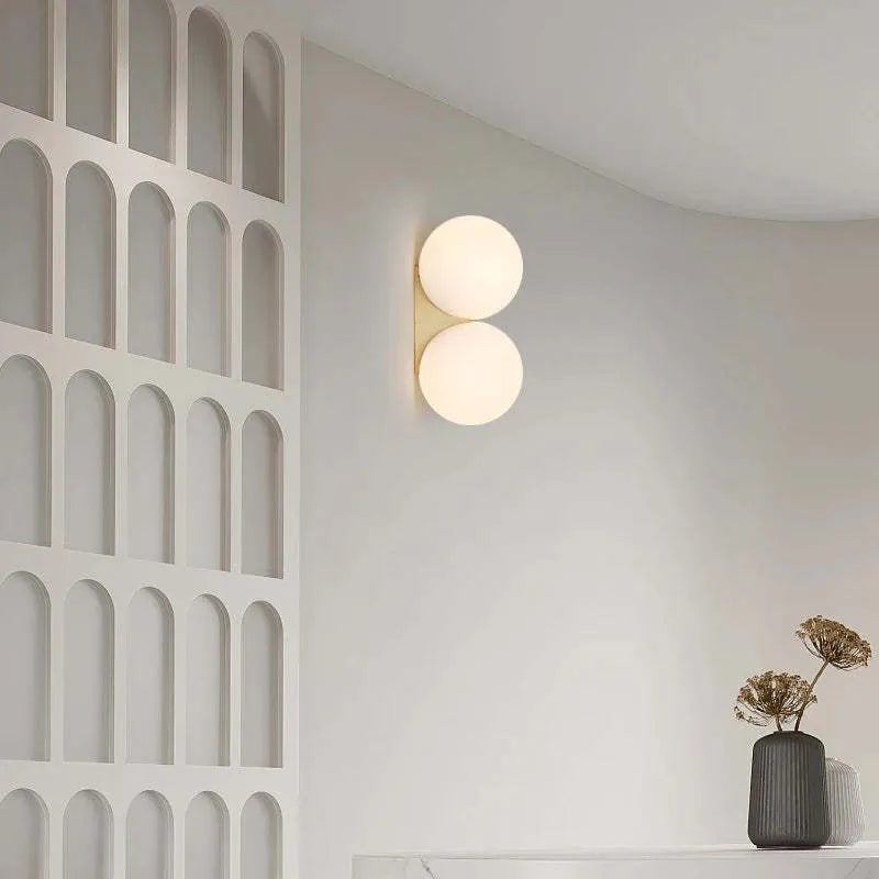 Nordic double-headed gold wall lamp with glass ball shade for bedroom bedside